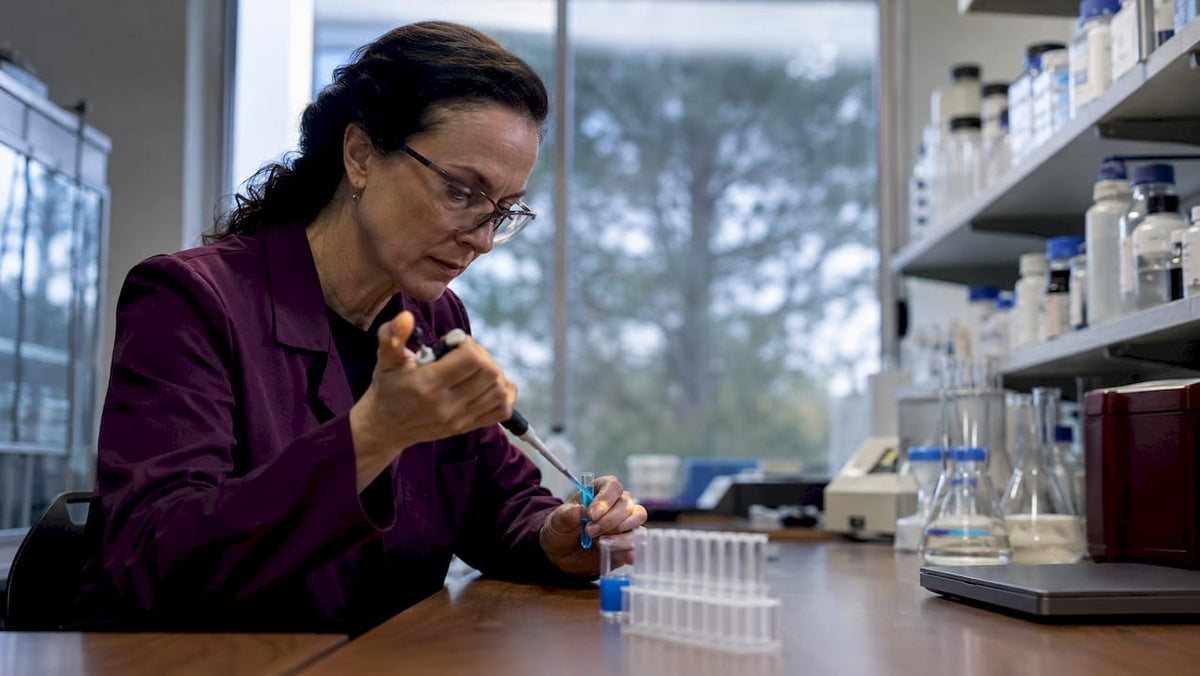 Scientist handling NMN NAD samples in lab