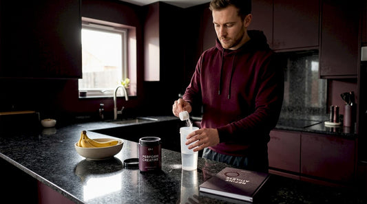 Man preparing creatine drink in morning kitchen
