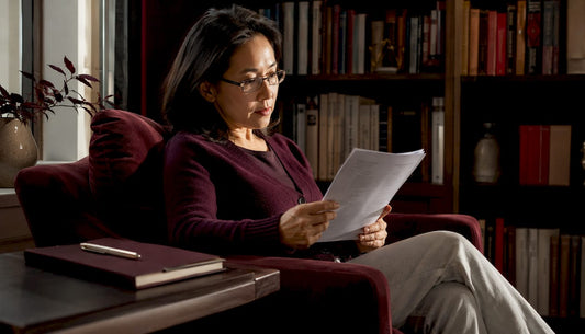 Woman researching NAD+ longevity supplements at home desk