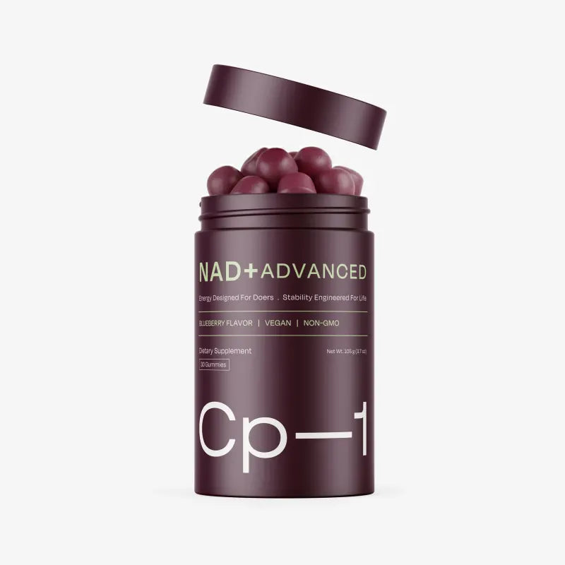 An open CP-1 jar with its lid lifted, full of blueberry gummies